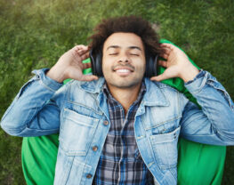 Young man enjoys the music in headphones