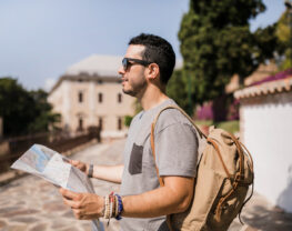 Male tourist holding map in his hand